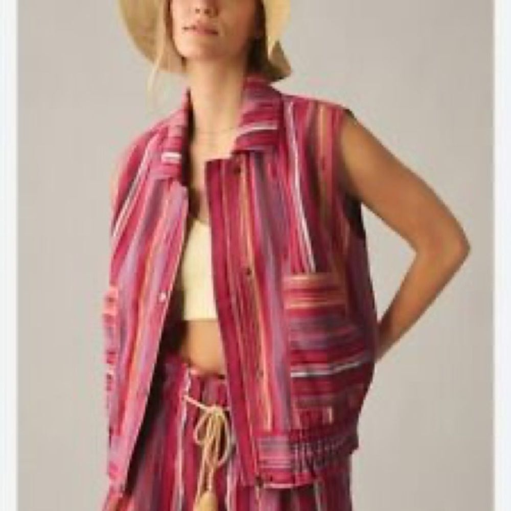 Anthropologie Short cut ruffled bottom vest